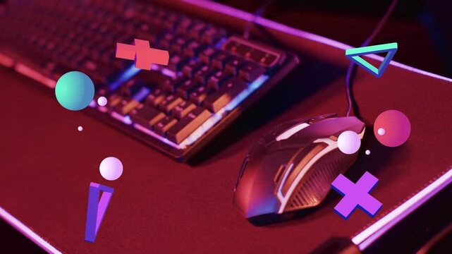 Loop starting 3D shapes drifting over wired gaming mouse, rotating and reversing, showcasing mouse