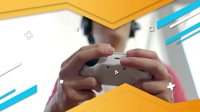 Man operating wired gamepad, button input starting sliding chevrons and gaming icons, playing game