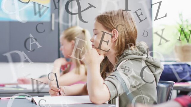 Foreground girl holding pencil, moving hand to paper, writing for classwork, letters aligning