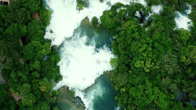 Cinematic footage of Plitvice Lakes National Park in Croatia featuring turquoise lakes, cascading waterfalls, wooden pathways, and lush forest landscapes
