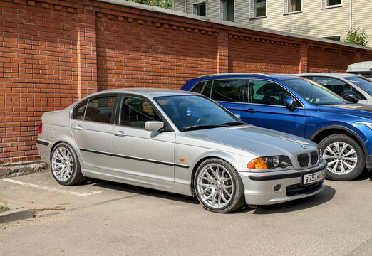 BMW 3 series e 46 in a parking lot. Motor car BMW E46 3-series 325 parked on street. Exterior of a fourth generation of the BMW 3 Series (E46) silver color. 