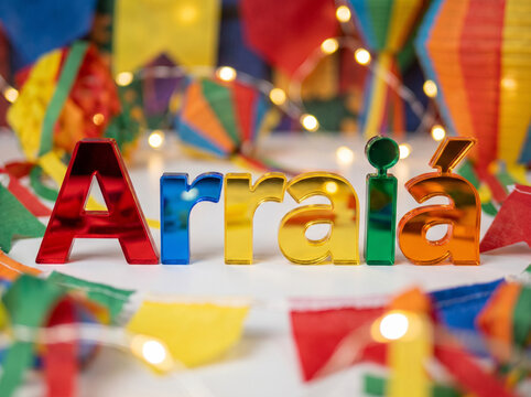 Arraia colorful letters on white surface studio shot