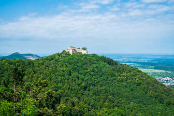 Naklejka premium Germany, Panoramic forest and mountain scenery surrounding historic Hohenneuffen fortress ruins high above the Swabian Jura countryside