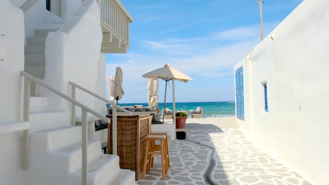 Wander the sunlit alleyways of Naousa Paros, Greece, where whitewashed buildings meet the azure sea. Delight in the tranquil atmosphere and vibrant culture of this beautiful Cycladic island.