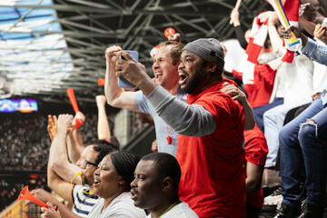 Diverse fans excited of winning ticket for live betting after final whistle, dramatic football match filled with tension and excitement. Friends celebrate lucky win on betting app, adrenaline. © DC Studio