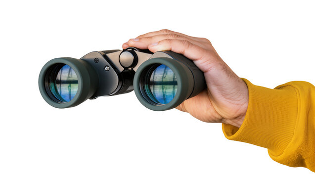 Hand holding dark green binoculars with blue lens reflection