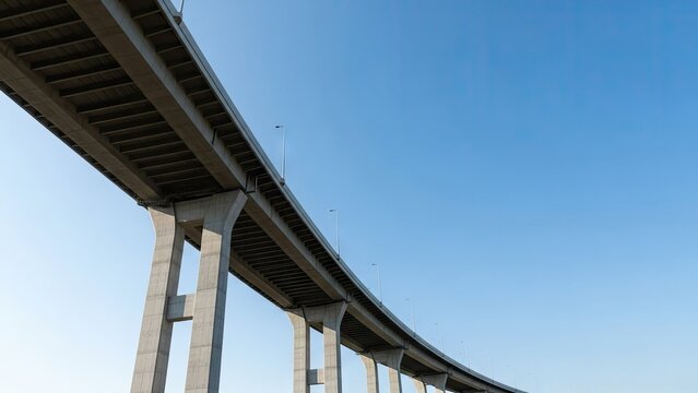 Low angle view of modern concrete highway bridge against sky