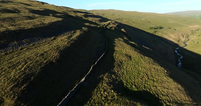 Flying above stonewalls on the hills