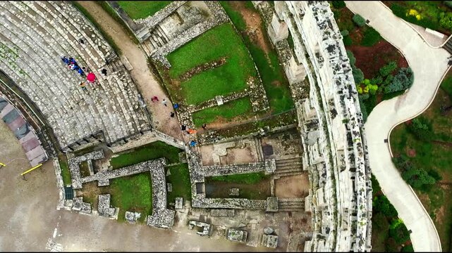 Cinematic aerial drone footage of Pula featuring historic architecture, Adriatic coastline, marina, and Mediterranean atmosphere. Scenic coastal views and ancient Roman heritage .