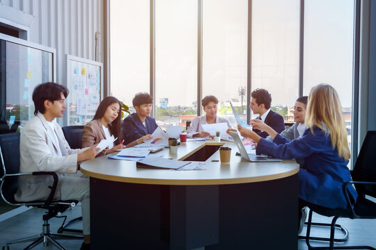 Successful happy workers Group of business people with Multiethnic workers with in company workers Group of asian business people and support Teamwork in the meeting room at modern office.