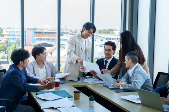 Successful happy workers Group of business people with Multiethnic workers with in company workers Group of asian business people and support Teamwork in the meeting room at modern office.