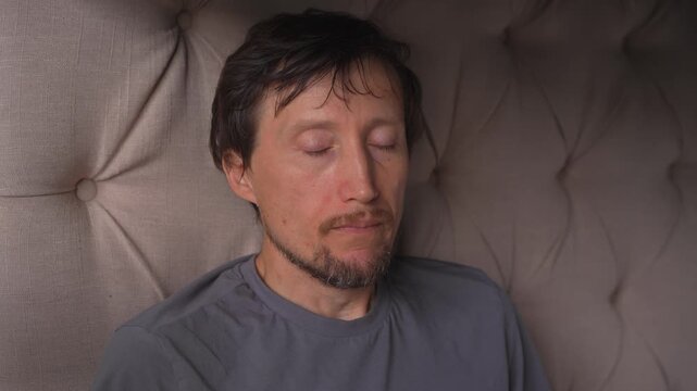 Man taking a deep breath, holding it and forcefully exhaling through closed lips, high quality uncompressed audio recording. Strong airflow and pressure release. Breathing control and human physiology