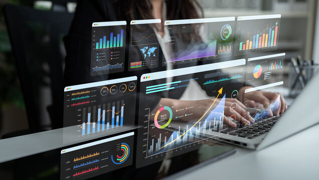 Professional Business Analysis with Data Visualization and Graphs Displayed on Multiple Screens in a Modern Office Environment. Bitwise.