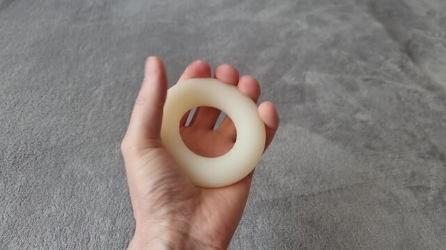Close-Up Video of Hand Squeezing Grip Strength Trainer
