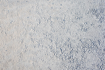 Fototapeta premium Light grey asphalt texture background, rough concrete sidewalk surface