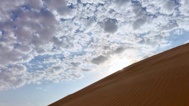 Desert Dawn Tranquility. Bright Morning Colors Fill Vast Sands. Morning Light Illuminates Arid Desert Landscapes With Scattered Clouds Creating Serene Scene For Meditation