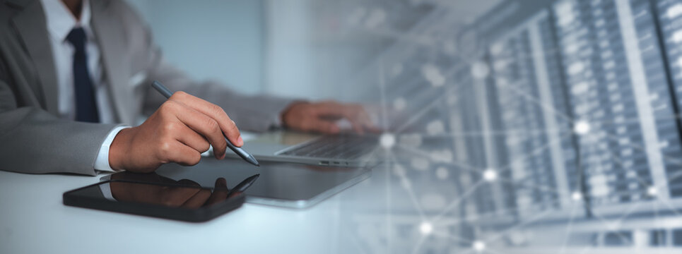 Businessman using digital tablet with double exposure of network connection and server room background. Concept of big data analytics, cloud computing, and global business technology.