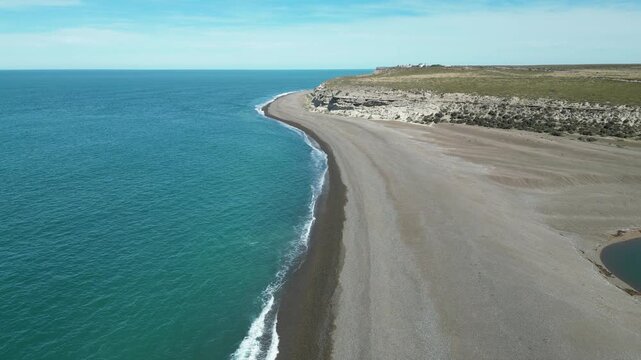 Aerial view of rocky coastline and turquoise sea at Peninsula Valdes in Patagonia Argentina