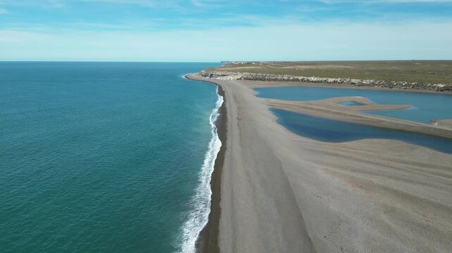 Aerial view of coastal lagoon and curved shoreline at Peninsula Valdes in Patagonia Argentina