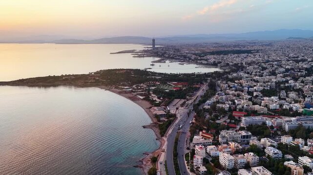 Aerial view of the Athens Riviera coast in Voula and Glyfada until back to Ellinikon during sunset time, Greece