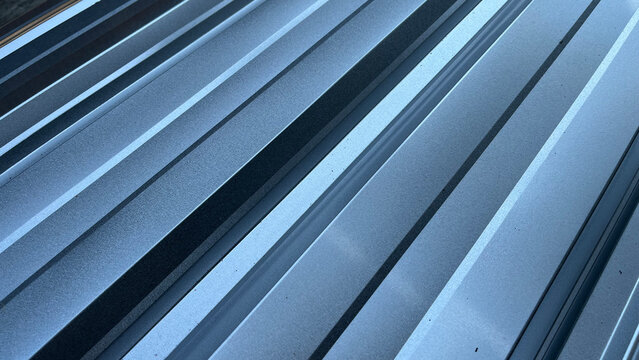 Close Up of Diagonal Galvalume Metal Roofing Sheet with Sun Flare
