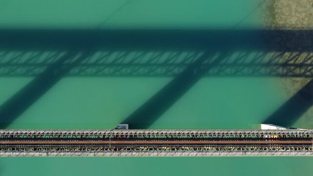Railway bridge crossing a river, aerial drone view. Railway bridge over the lake, view from above. Transportation. 