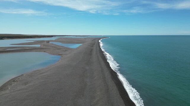 Aerial view of coastal sandspit and tidal lagoons at Peninsula Valdes Patagonia Argentina