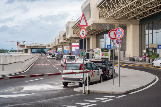Ferno, Milan-Malpensa, Lombardy, Italy - May 6, 2026: The departures area of Terminal 1 at Milan Malpensa Airport, with a monitored area for temporary vehicle parking.