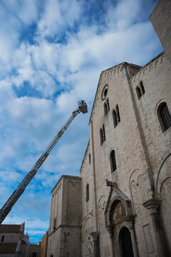 A fire crew removes dirt from the Church of Saint Nicholas in Bari.