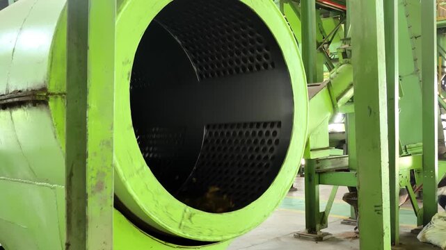 Industrial palm oil digester machine processing oil palm fruit in mill, manufacturing heavy machinery in factory plant