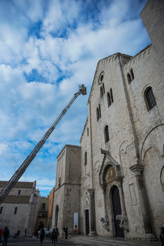 A fire crew removes dirt from the Church of Saint Nicholas in Bari.
