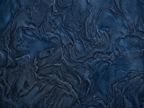 Dark blue textured bas relief plaster backdrop for premium cosmetic presentation