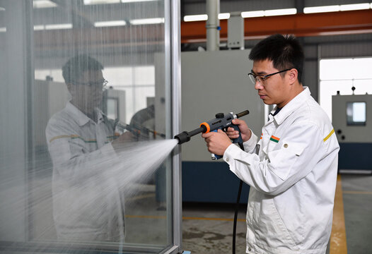 Industrial glass cutter at work with water jet