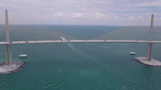 Cinematic aerial parallax shot of Sunshine Skyway Bridge over Tampa Bay