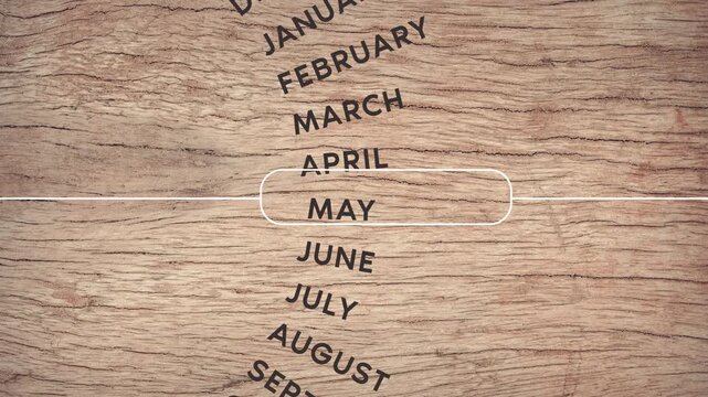 circular calendar motion months in animation in red font, Wood texture 4K video