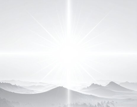 Overexposed sunburst illuminates ethereal, misty mountain landscape