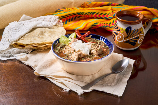 Mexican menudo stew in traditional bowl
