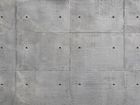 A concrete wall with holes 