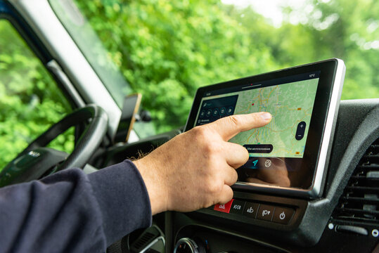 Driver operating car GPS navigation system