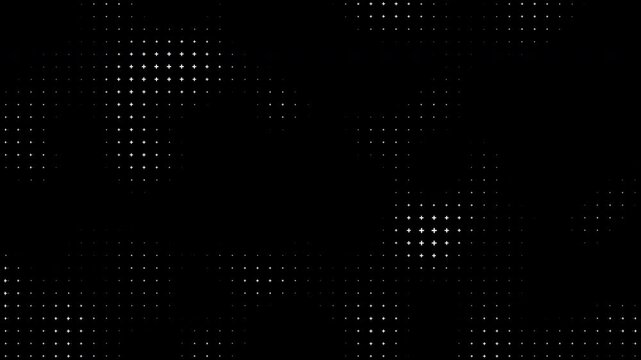 White halftone crosses move and change size on a black background with alpha channel creating a dynamic pattern of cross that flow across the dark digital screen display.