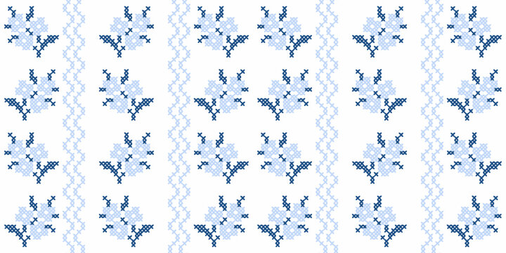Blue cross stitch floral seamless pattern with traditional embroidery folk art motifs.