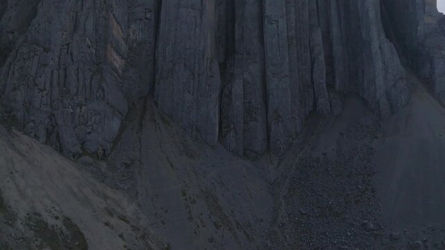 Slow aerial pull back revealing Castillo de Vichaycocha rock formation in the high Andes of Lima, Peru