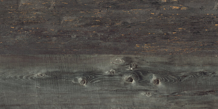 Dark grey background of knotty and grainy wood