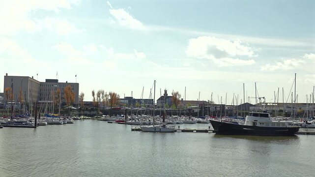 Wide view of marina harbor with moored sailboats in Dunkirk France