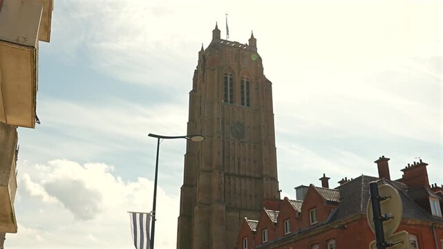Saint Eloi Church tower rising above brick buildings in Dunkirk France