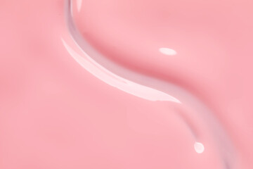 Fototapeta na wymiar Pink nail polish as background, top view