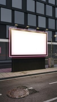 Blank glowing neon billboard mockup on a city street at night