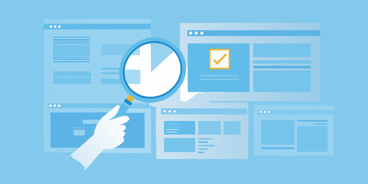 hand holding magnifying glass over web page layouts