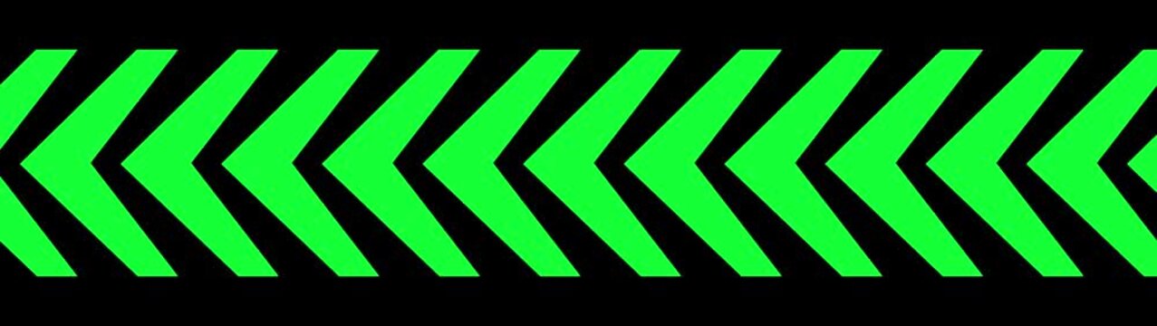 A continuous horizontal band of bright, neon green chevron arrows pointing to the left, outlined by a thin black border, against a solid black background, evoking a sense of energy, warning, or