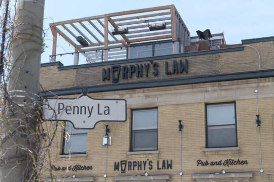 ghost signs outside Murphy's Law Pub and Kitchen at 1702 Queen St E and Penny Ln, Toronto